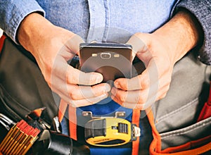 Worker holding a smartphone