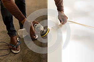Worker Industrial tool hand grinder spolishing marble top
