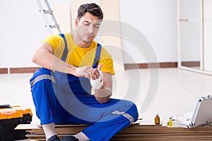 The worker with injured hand at construction site