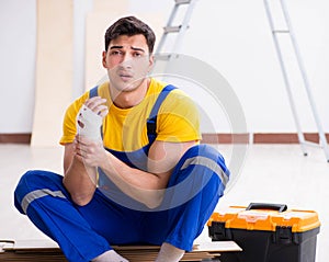 Worker with injured hand at construction site