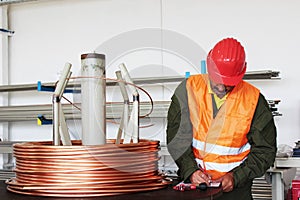 Worker inspect copper wire