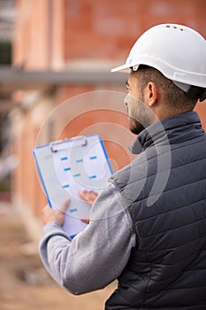 worker inspector or engineer checking and inspecting building