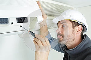 Worker installing air clim