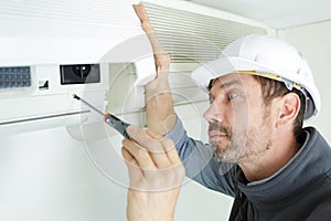 Worker installing air clim