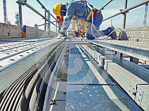 Worker are installing cable tray