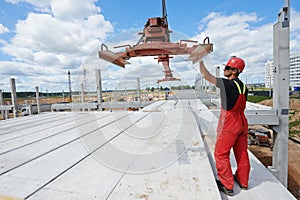 Worker installing concrete slab