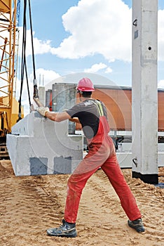 Worker installing concrete slab