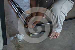 worker installing mosquito wire screen door