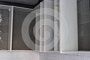 Worker installing new countertop in modern kitchen