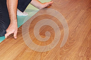 Worker installing new laminate flooring