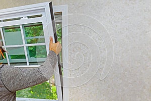 Worker in the installing new, windows in an house, with a new window in the home renovation living energy efficiency