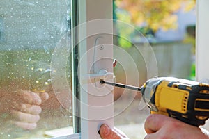 Worker installing or repairing new lock