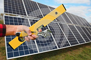 Worker installing solar panels outdoors