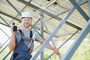 Worker installing solar panels outdoors