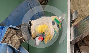 The worker insulates the walls with drywall