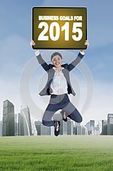 Worker jumps with business goals for 2015