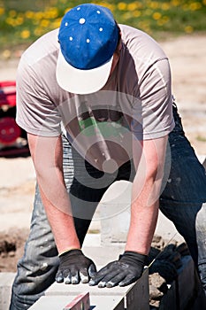 Worker laying bricks