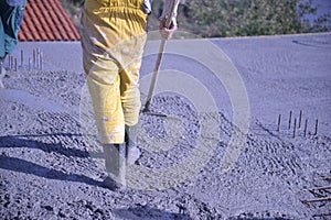 Worker Levelling Concrete