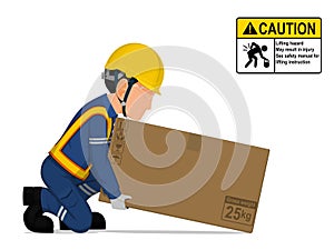 A worker is lifting a big box on the floor