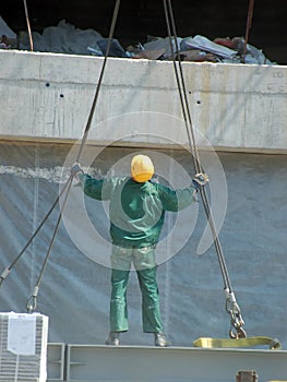 Worker with lifting ropes
