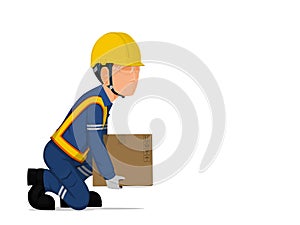A worker is lifting a small box on the floor