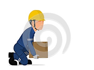 A worker is lifting a small box on the floor