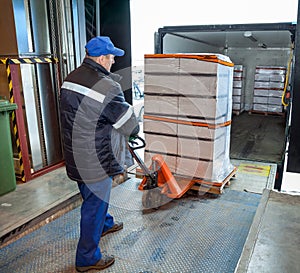 Worker loading on truck