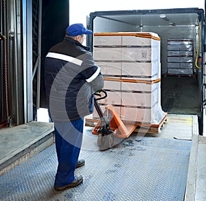 Worker loading on truck photo