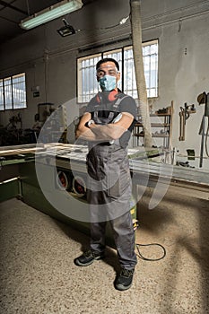 Worker looking at camera smiling in a factory