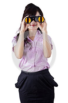 Worker looking her vision with binocular