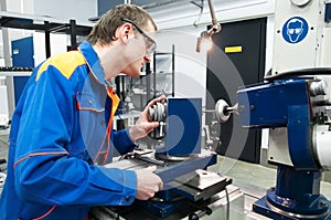 Worker at machine tool operating