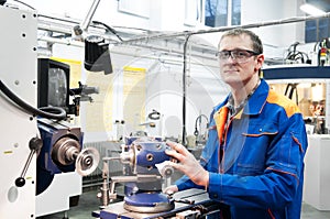 Worker at machine tool operating