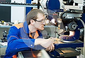 Worker at machine tool operating