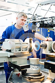 Worker at machine tool operating