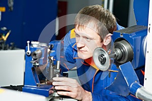 Worker at machine tool operating