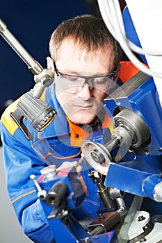 Worker at machine tool operating