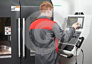 Worker at machining tool workshop