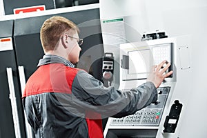 Worker at machining tool workshop