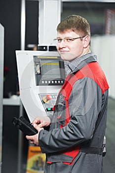 Worker at machining tool workshop
