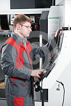 Worker at machining tool workshop