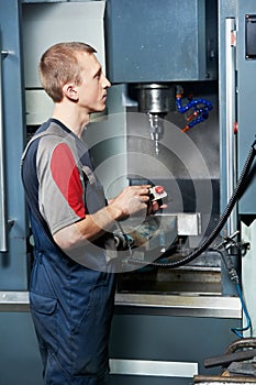 Worker at machining tool workshop