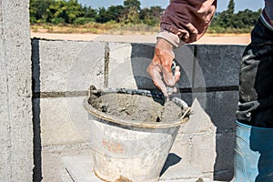 Worker make concrete wall