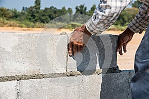 Worker make concrete wall