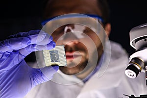 Worker making diagnostics of chip