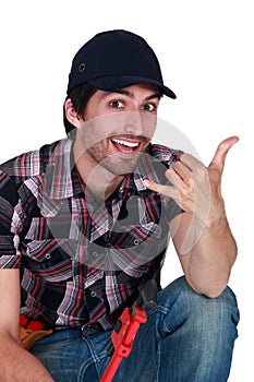 Worker making a hand sign.