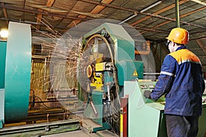 Worker making reinforcement for pipe