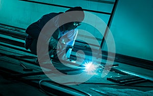 worker making sparks welding steel