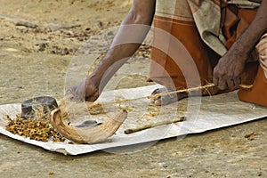 Worker making twine from coconut, Sri Lanka