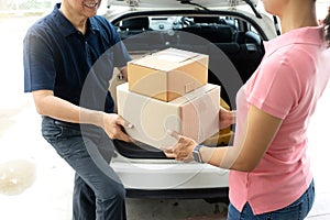worker man delivery the boxs to woman