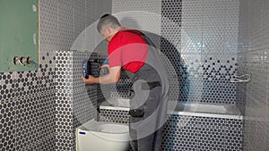 Worker man install mechanism of toilet water flushing system